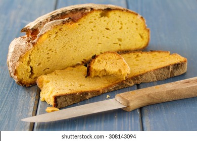 Corn Bread With Knife On Blue Wooden Background