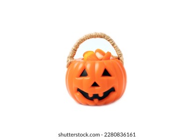 Corn candy in isolated white background Halloween concept  Bucket Halloween pumpkin Jack  o  lantern and candy corn for halloween celebration Pumpkin and scary smile his face Candy bucket 