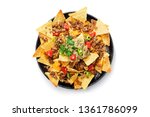Corn chips nachos with fried minced meat and guacamole isolated on white background.
