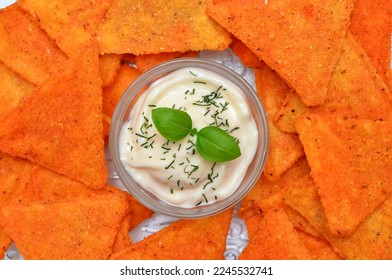 corn chips and sour cream sauce close up, mexican appetizer close up - Shutterstock ID 2245532741