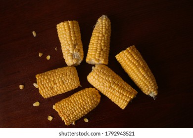 The corn cobs are on the table.  Image with selective focus, noise effects.
