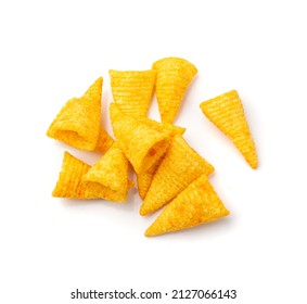 Corn cone pile isolated. Bugles chips, puffs with spices, crunchy puffed snacks, salty corn cones top view