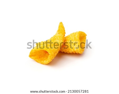 Corn cone pile isolated. Bugles chips, puffs with spices, crunchy puffed snacks, salty corn cones