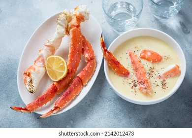 Corn Cream-soup Served With Boiled Kamchatka Crab Legs, Horizontal Shot On A Light-blue Stone Background, Selective Focus