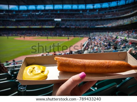 Corn dog at a baseball game