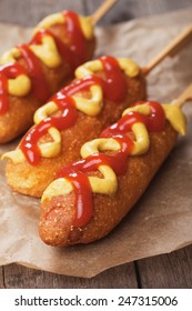 Corn Dog, Fried Sausage In Batter With Mustard And Ketchup