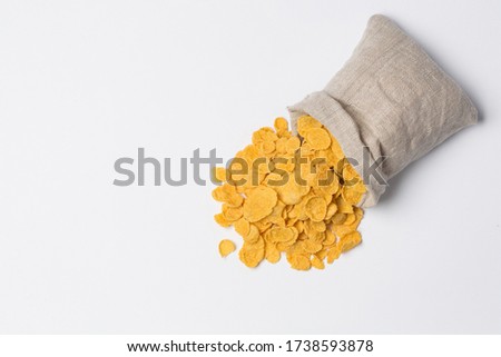 Corn flackes in sack isolated on white in studio