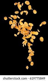 Corn Flakes Flying Isolated On Black Background