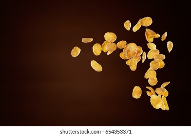 Corn Flakes Flying Isolated On Brown Background