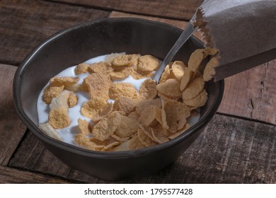 Corn Flakes With Milk And Banana Chunks For Breakfast