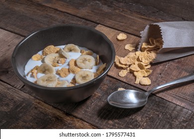 Corn Flakes With Milk And Banana Chunks For Breakfast