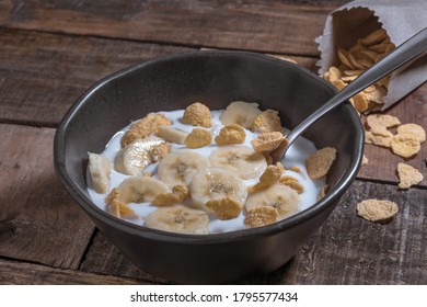 Corn Flakes With Milk And Banana Chunks For Breakfast