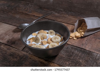 Corn Flakes With Milk And Banana Chunks For Breakfast