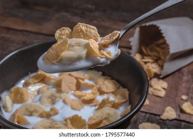 Corn Flakes With Milk And Banana Chunks For Breakfast