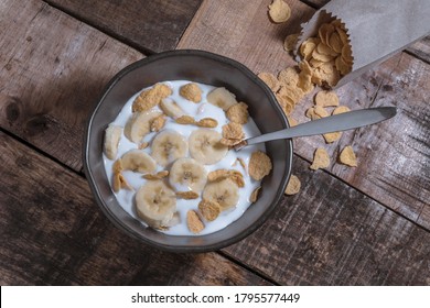 Corn Flakes With Milk And Banana Chunks For Breakfast