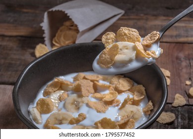 Corn Flakes With Milk And Banana Chunks For Breakfast