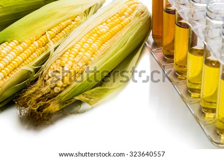 Corn generated ethanol biofuel with test tubes on white background