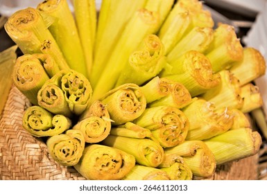 Corn husks inside a straw hat prepared to make Pamonha. Sweet eaten at June and São João parties in Brazil.