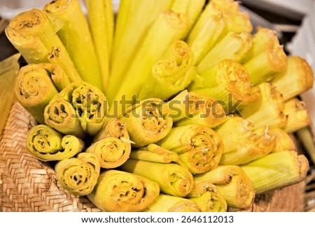 Corn husks inside a straw hat prepared to make Pamonha. Sweet eaten at June and São João parties in Brazil.