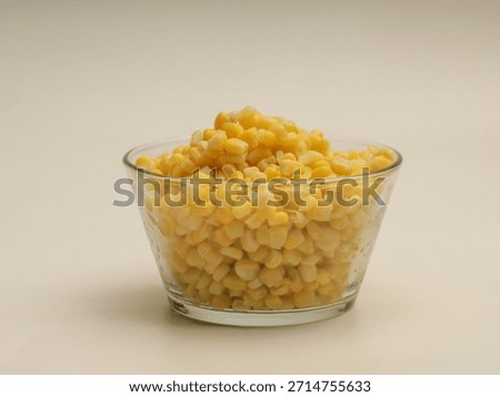 Corn kernels in a bowl isolated