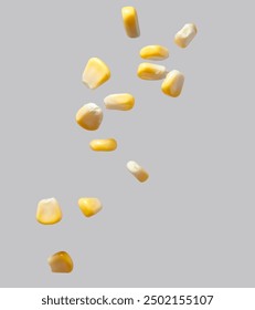 The corn kernels are flying against a gray background