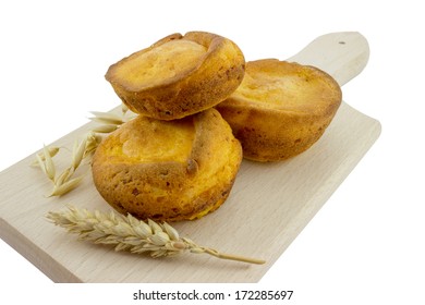 Corn Muffins On A Cutting Board Isolated On White With Clipping Path