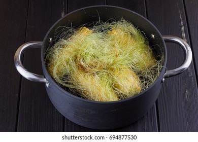 Corn on the cob boiling in a pot