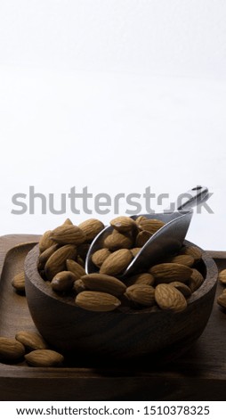 Similar – Image, Stock Photo Wooden background with almonds and chia seeds