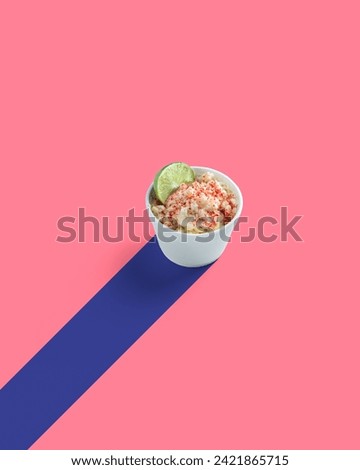 Corn Preparation in a Cup, Esquite, Mexican Snack, Street Food, Spicy, Chamoy, Chili Powder, Minimalist mexican pink Background, no people