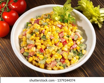 Corn Salad With Pepper And Mayonnaise On Wooden Background