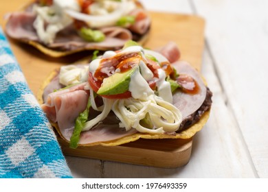 Corn Toast With Ham And Oaxaca Cheese On White Background. Traditional Mexican Food