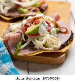 Corn Toast With Ham And Oaxaca Cheese On White Background. Traditional Mexican Food