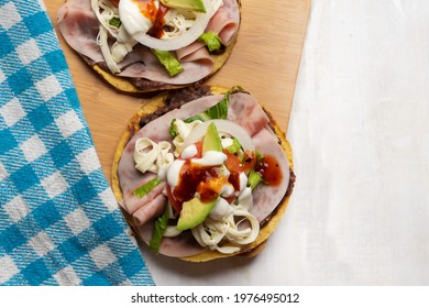 Corn Toast With Ham And Oaxaca Cheese On White Background. Traditional Mexican Food