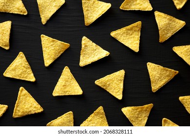 Corn Tortilla Chips On A Black Background, Top View. Flat Lay, Overhead, From Above.