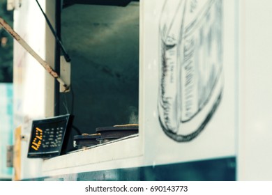 Corn Tortillas For Tacos Cooking In The Window Of A Food Truck