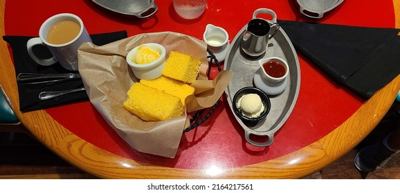 Cornbread With Butter, Jam And Syrup