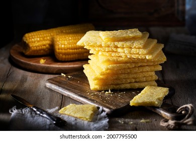 Cornbread Stacked On A Rustic Table