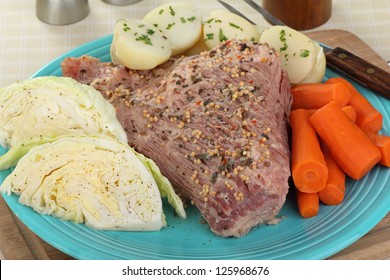 Corned Beef Brisket With Cabbage, Carrots And Potatoes On A Plate