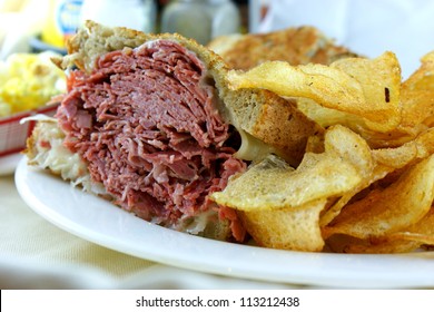 Corned Beef Reuben Sandwich - Fresh corned beef on grilled Rye with melted Swiss and sauerkraut.