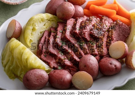 Corned beef sliced served with cabbage, potatoes and carrot, traditional Irish recipe for Saint Patricks day