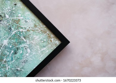 Corner of abstract modern picture in black frame. Picture framing concept. Copy space.