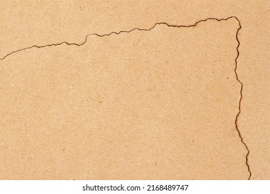 Corner Of Burnt Piece Of Kraft Paper On Craft Background Close-up, Copy Space