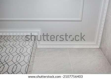 corner of ceiling cornice with intricate crown molding. 