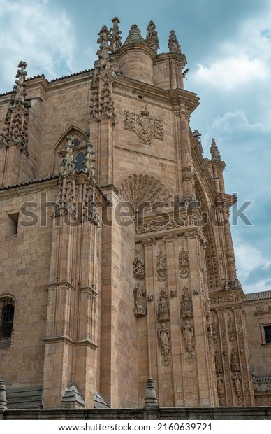 A corner of the\
convent of San Esteban ornamented in Gothic and Plateresque style\
in Salamanca, Spain