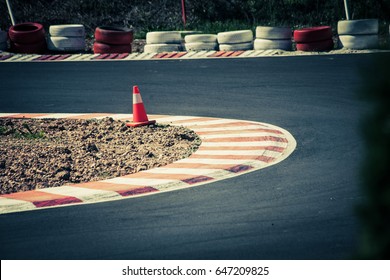 Corner Of The Gokart Track With Curb And Cone On New Asphalt Surface