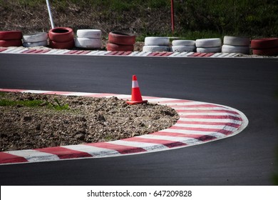 Corner Of The Gokart Track With Curb And Cone On New Asphalt Surface
