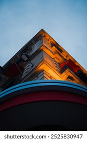 Corner of a Multi Level Building in Braoque Style Lit Up with Lights Rising Up into the Sky