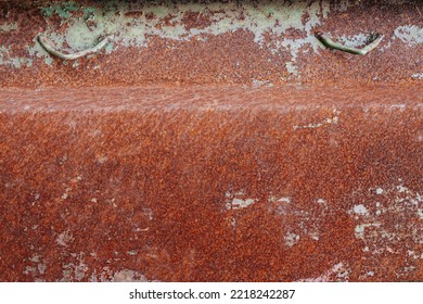 Corner Of A Rusted Metal Box. Orange Degraded Dented Texture. With White Patches.