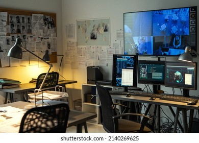 Corner Of Small Office Of FBI Agency With Set Of Criminal Profiles Hanging On Board And Large Screen Security Camera On Wall