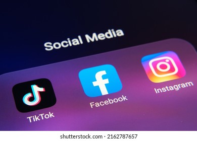 Corner Of Smartphone With Facebook, TikTok, Instagram Apps Grouped Together. Concept For Competition. Stafford, United Kingdom, May 19, 2022.